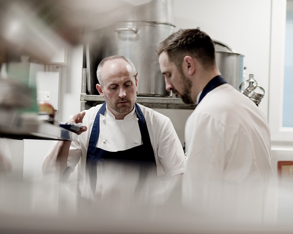 Stevie McLaughlin and colleague preparing food in Restairant Andrew Fairlie kitchen